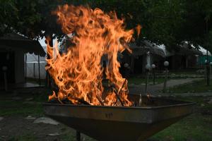 a fire in a fire pit in a yard at starry nights stay in Batakūt