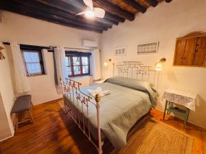 a bedroom with a bed in a room at Byzantino Omodos House in Omodos