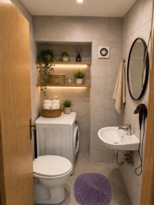 a bathroom with a toilet and a sink at AS Lux apartment tetovo in Tetovo +13 photos