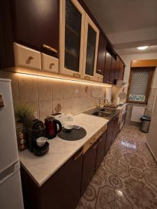 a kitchen with a sink and a counter top at AS Lux apartment tetovo in Tetovo