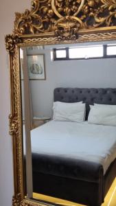 a mirror reflection of a bed in a bedroom at 2Bedroom Luxury hotel apartment Fourways in Johannesburg +7 photos