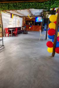 a large room with a table and chairs in it at Huiltana ecohotel&resort in Guataquí