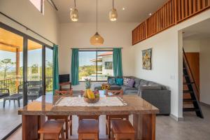 a living room with a table and a couch at Area 101 in Playa Pelada