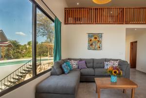 a living room with a couch and a table at Area 101 in Playa Pelada