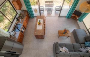 an overhead view of a living room with a couch and a table at Area 101 in Playa Pelada