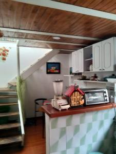 a kitchen with a counter with a blender on it at Hospedaje Patty Cajicá in Cajicá