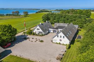 an aerial view of a house with a large yard at Main House - Rolsø Retreat in Knebel