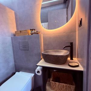 a bathroom with a bowl sink and a mirror at LemonTreesHouses 1 Peaceful Stay Near Athens Airport & Rafina Port in Pikérmion +24 photos