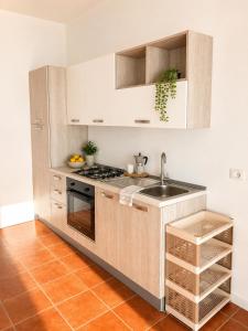 a kitchen with a sink and a stove at Affaccio degli Dei in Drapia