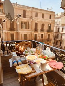 a table with food on top of a balcony at suites in cairo downtown in Cairo