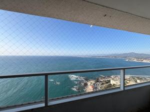 a view of the ocean from a balcony at Oceana Suites Costa Montemar in Concón