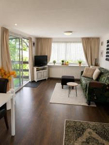 a living room with a couch and a table at RB&B in the NOP in Bant