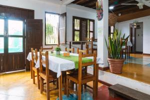 a dining room with a table and chairs at Waira Selva Hotel in Puerto Nariño