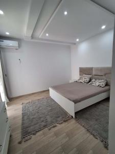 a bedroom with a large bed in a room at Dar sirine in Arkou +21 photos