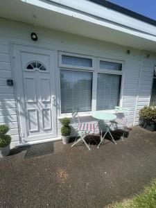 a table and two chairs in front of a garage at SeaStar Dartmouth in Dartmouth