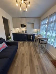 a living room with a couch and a table at SeaStar Dartmouth in Dartmouth
