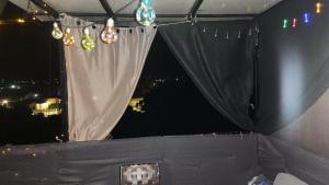 a view of a stage with lights and a curtain at Jim3 moterno studio fast wi-fi with a view in Andravída