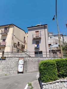 a building with balconies on the side of a street at Casa di Francesca in Ruvo del Monte