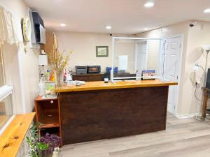 a kitchen with a sink and a counter top at Sackville Inn in Sackville
