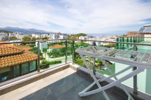 a balcony with a view of a city at Hotel Vathi in Ksamil