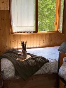 a bed in a room with a window at Mira Moleta bienvenidos a Canfranc in Canfranc-Estación +28 photos