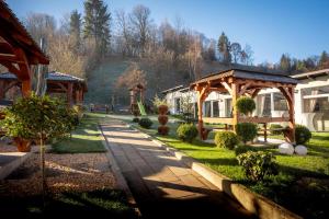 a garden with a gazebo and a pathway at Casa Ina in Moisei