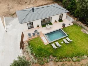 an aerial view of a house with a swimming pool at Villa Ezilia in Alata