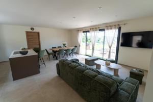 a living room with a couch and a table at Villa Ezilia in Alata