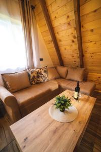 a living room with a couch and a table at Poscenje in Šavnik +20 photos