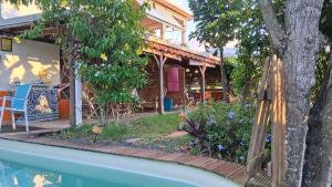 a house with a swimming pool in front of a house at T2 KAY ZANNDOLI in La Trinité