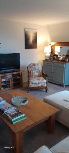 a living room with a couch and a coffee table at Hillview Homestay in Richmond