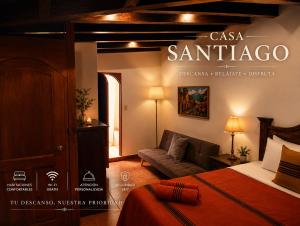 a hotel room with a bed and a couch at Casa Santiago Son 2 in Antigua Guatemala