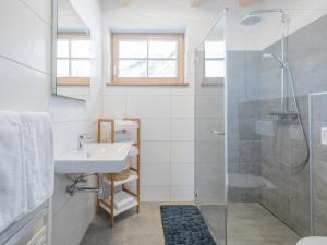 a bathroom with a sink and a shower at Bergzauber in Donnersbachwald +25 photos