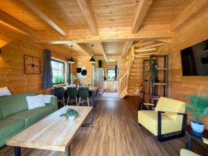 a living room with a couch and a table at Rattendorf 22A in Rattendorf