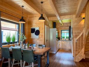 a dining room with a table and chairs at Rattendorf 22A in Rattendorf