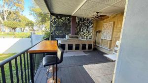 a patio with a stove and a table on a balcony at Waterlink Retreat in South Yunderup
