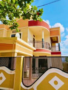 a building with a fence in front of it at EDEN PALACE KIGALI AIRPORT AND APARTMENTs in Kigali