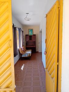 a hallway with a living room with a couch at Chácara sol nascente in Suzano +14 photos
