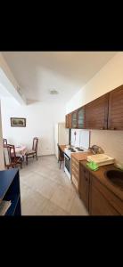 a kitchen with a sink and a stove top oven at Miković Apartments in Herceg-Novi
