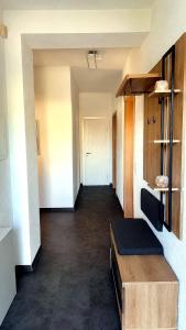 a hallway of an office with a table and a room at Four Rooms Allgäu Apartment in Wangen im Allgäu +1 photo
