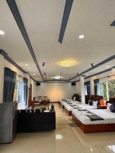 a room with a bunch of beds in it at Kep Queen Boutique in Phumĭ Ŏng Char +36 photos