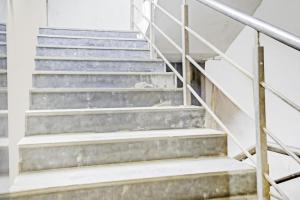 a set of stairs in a building at Collection O One Hotel in Ghaziabad