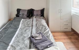 a bed in a bedroom with two towels on it at Gorgeous Home In Rybical With Wifi in Rybical