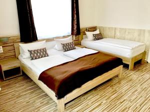 מיטה או מיטות בחדר ב-City Central Promenade
