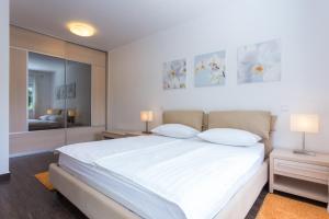 Posteľ alebo postele v izbe v ubytovaní Apartments Villa Alba