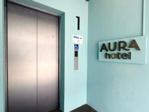 a door in a building with a ninecca motel sign at Aura Hotel Mackenzie in Singapore