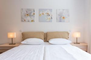 Posteľ alebo postele v izbe v ubytovaní Apartments Villa Alba