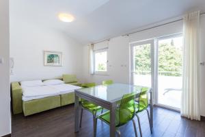 Posteľ alebo postele v izbe v ubytovaní Apartments Villa Alba
