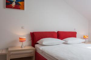 Posteľ alebo postele v izbe v ubytovaní Apartments Villa Alba