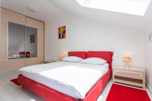 Posteľ alebo postele v izbe v ubytovaní Apartments Villa Alba